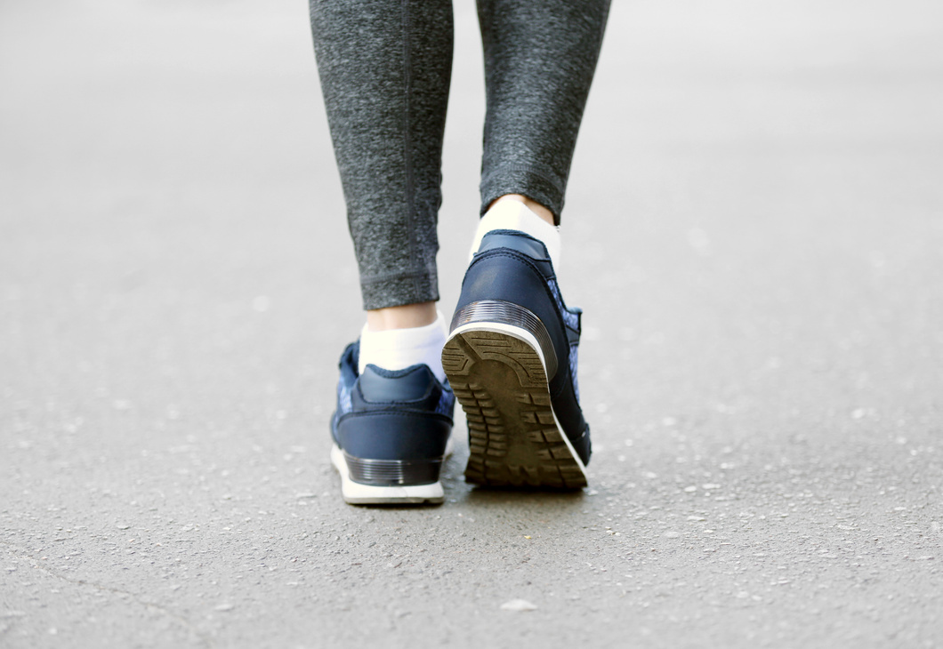 Sports Woman Legs in Running Movement